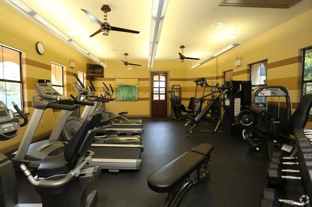Treadmills ellipticals weight machines gym fitness room at Heron on Hausman in San Antonio Student Accommodation