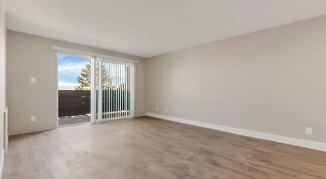 Empty room with sliding door and balcony living room at Mint Urban Infinity in Denver Student Accommodation