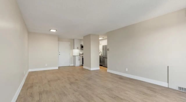 Empty apartment with kitchen and door living room at Mint Urban Infinity in Denver Student Accommodation