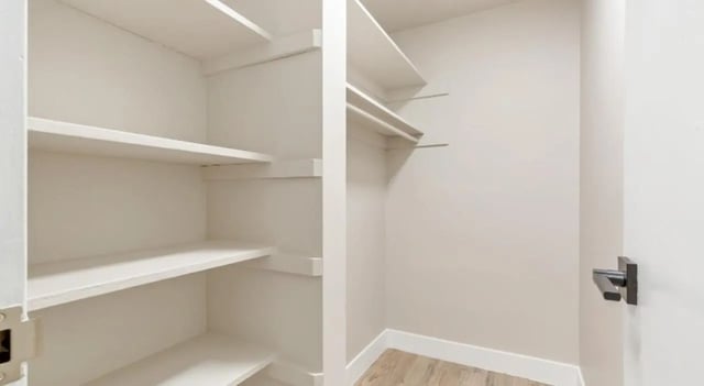 Empty closet with shelves and hanging rod closet at Mint Urban Infinity in Denver Student Accommodation