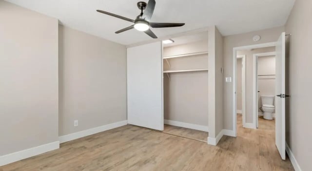 Closet and open toilet door Bedroom at Mint Urban Infinity in Denver Student Accommodation