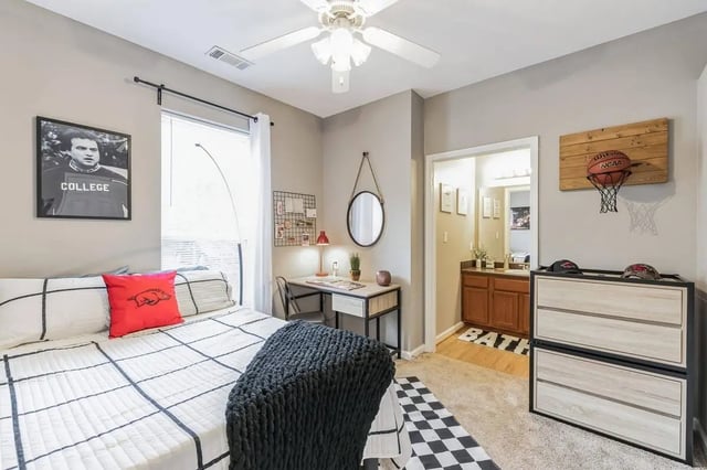 Bed desk lamp bulletin board basketball hoop dresser bedroom at Hill Place in Fayetteville Student Accommodation