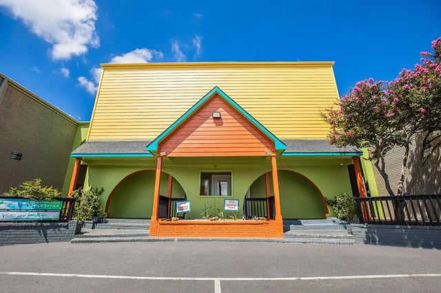 Colorful building entrance with arched doorways exterior at Villas De Sendero in San Antonio Student Accommodation