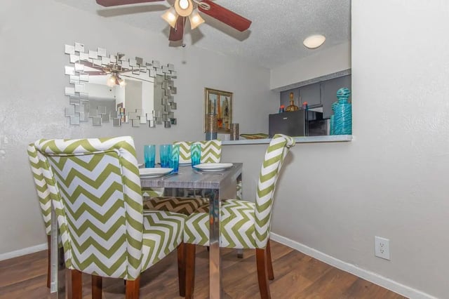 Chevron chairs dining table mirrored decor kitchen area dining room at Villas Del Solamar in Dallas Student Accommodation