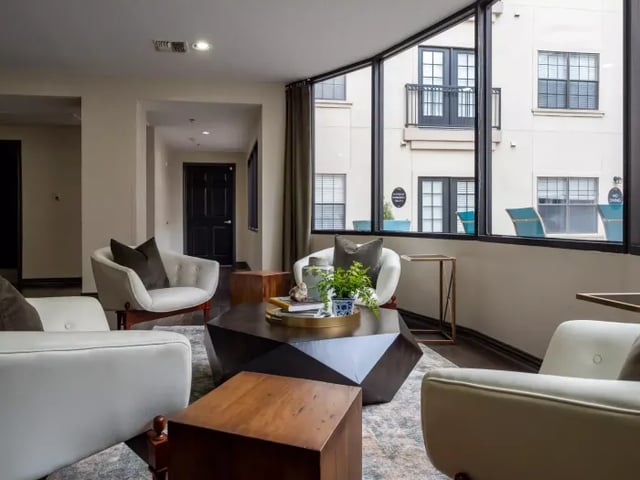 Modern living room with comfortable seating and coffee table living room at Vines at Turtle Creek in Dallas Student Accommodation
