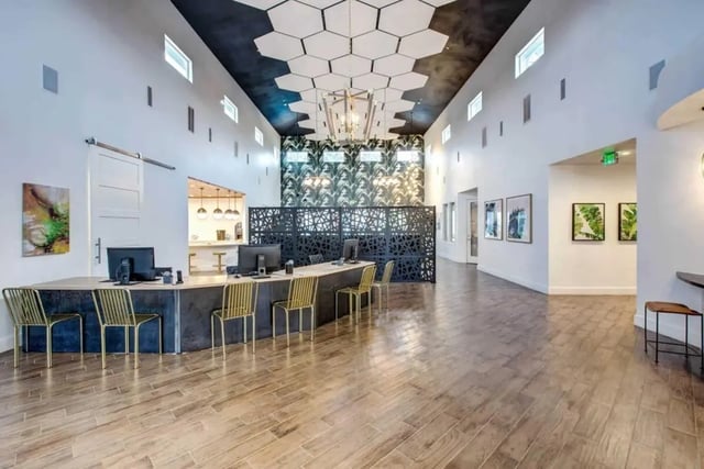 Reception desk with computers and chairs lobby at Cabana Beach San Marcos in San Marcos Student Accommodation