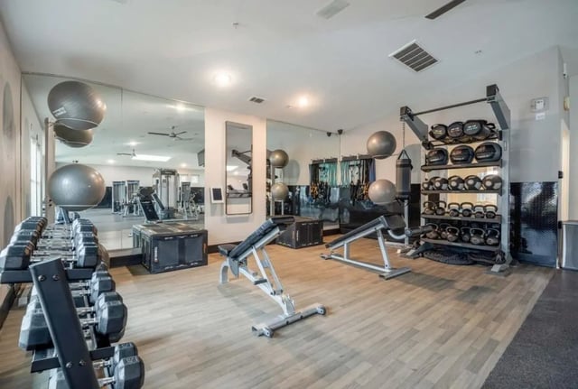 Dumbbells exercise balls benches workout equipment gym at Cabana Beach San Marcos in San Marcos Student Accommodation