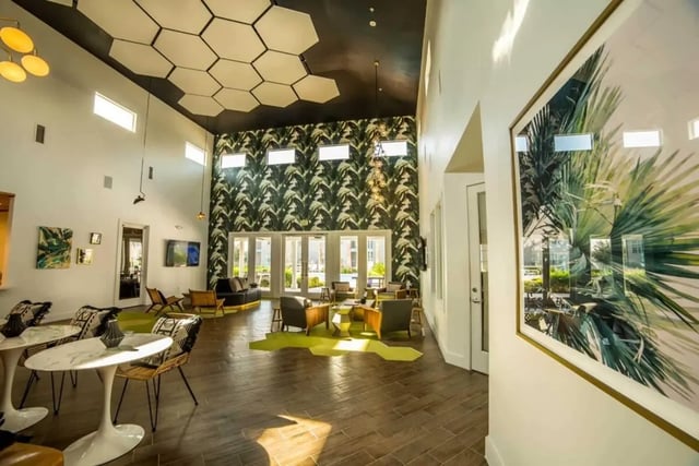 Stylish lounge seating with tropical wallpaper and artwork living room at Cabana Beach San Marcos in San Marcos Student Accommodation