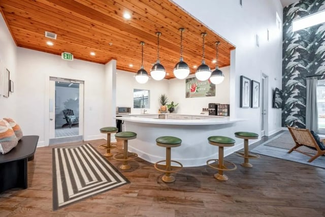 Counter with stools and kitchen area at Cabana Beach San Marcos in San Marcos Student Accommodation