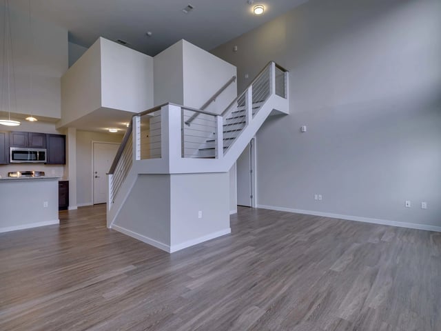 Modern staircase and kitchen cabinets living room at College and Crown in New Haven Student Accommodation