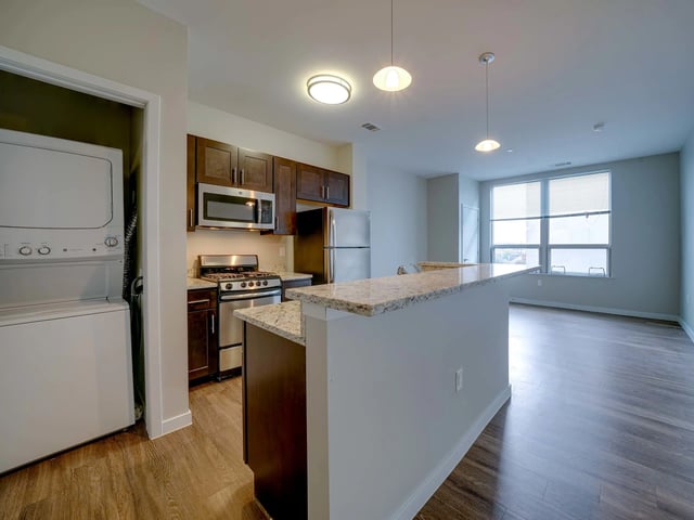 Washer dryer stove refrigerator kitchen island kitchen at College and Crown in New Haven Student Accommodation