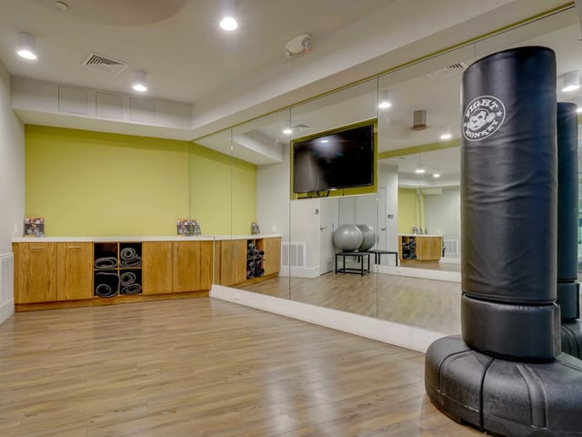 Punching bags and yoga mats gym area at College and Crown in New Haven Student Accommodation