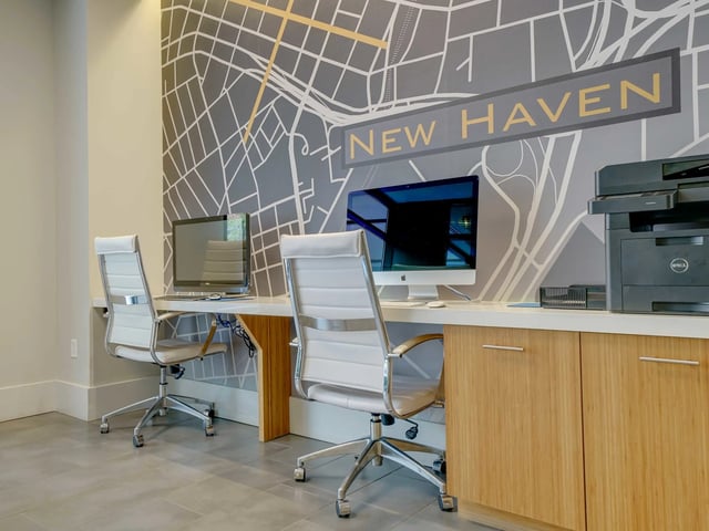 Computers chairs and printer in common area at College and Crown in New Haven Student Accommodation