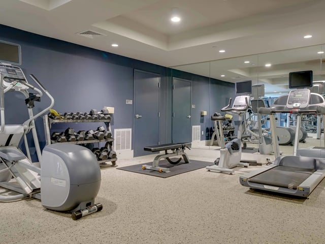 Elliptical treadmill dumbbells bench gym equipment gym at College and Crown in New Haven Student Accommodation