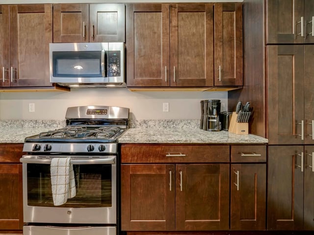 Kitchen with stainless steel appliances and cabinets Kitchen at College and Crown in New Haven Student Accommodation