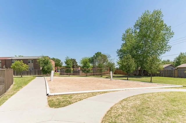 Volleyball court with sand and net outdoor playing area at Millennium in Norman Student Accommodation