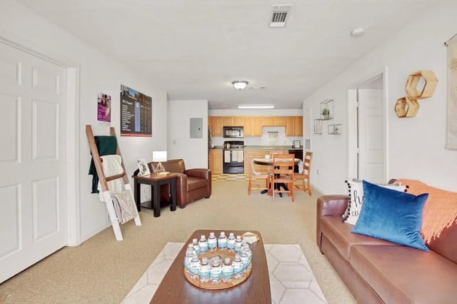 Sofa chairs coffee table dining table kitchen living room. at The Arch Troy in Troy Student Accommodation