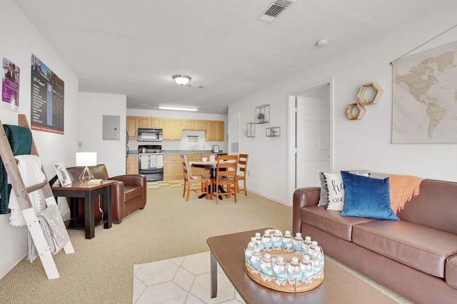 Leather sofa dining table kitchen living room exterior at The Arch Troy in Troy Student Accommodation