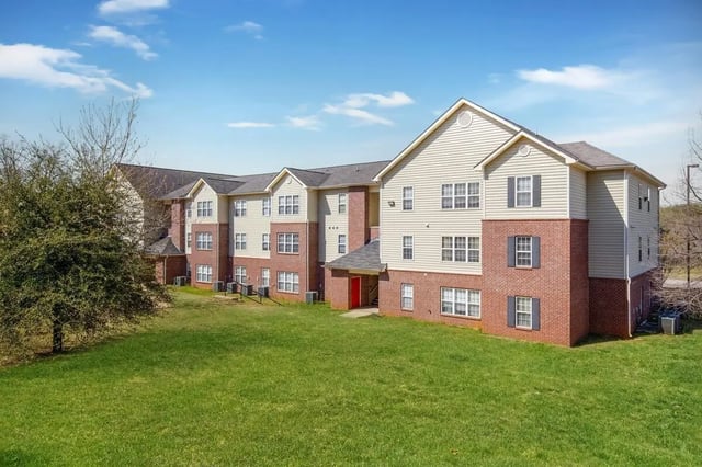 Apartment building with brick and siding exterior exterior at The Arch Troy in Troy Student Accommodation