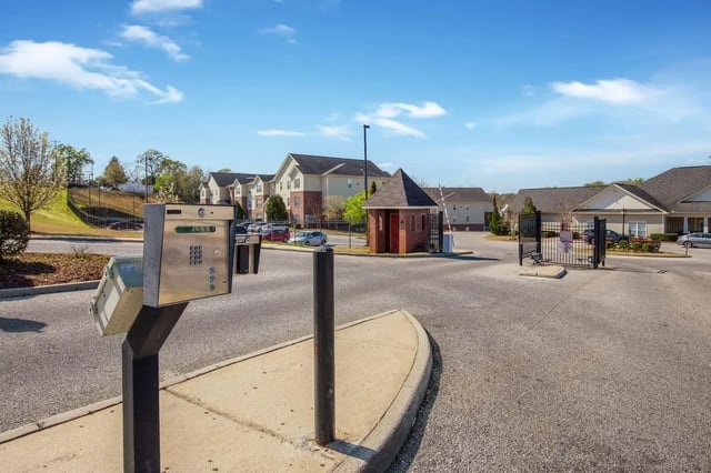 Intercom gate and apartment buildings exterior at The Arch Troy in Troy Student Accommodation