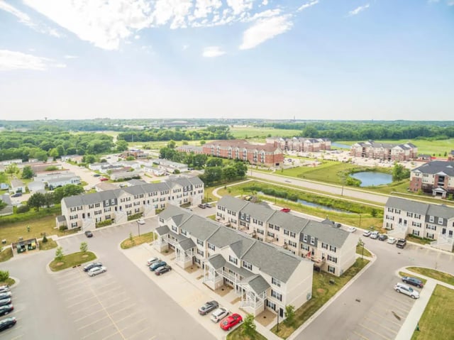 Townhouses with parking lots exterior at Copper Beech Townhomes - Ames in Ames Student Accommodation