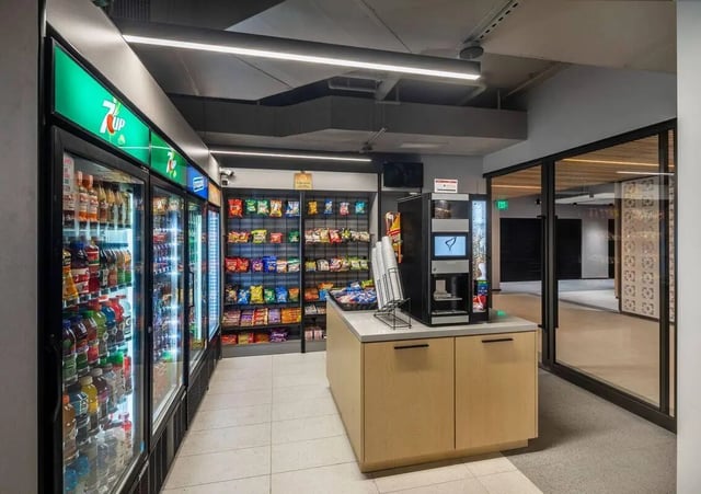 Beverage refrigerators snack shelves coffee maker lounge area at The Henry in Tampa Student Accommodation