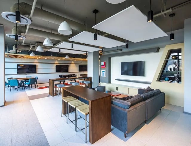 Sofa tables stools television and dining area living room at The Henry in Tampa Student Accommodation