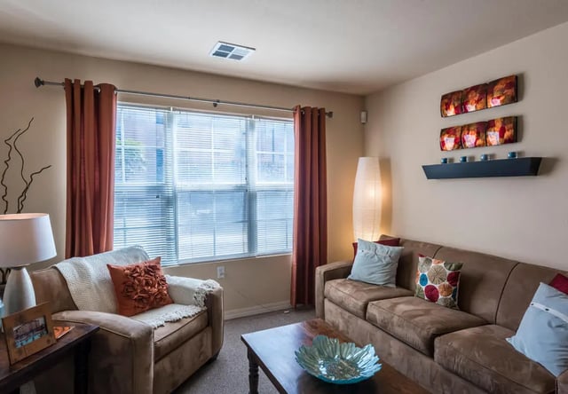 Two brown couches and armchair living room at The Verge at Las Cruces in Las Cruces Student Accommodation