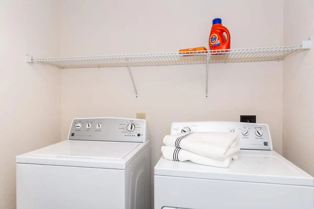 Washers dryer shelf Tide bottle laundry room at Grove at Slippery Rock in Slippery Rock Student Accommodation
