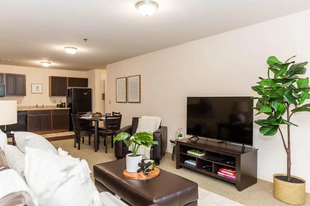 Living room with kitchen and dining area living room at Grove at Slippery Rock in Slippery Rock Student Accommodation