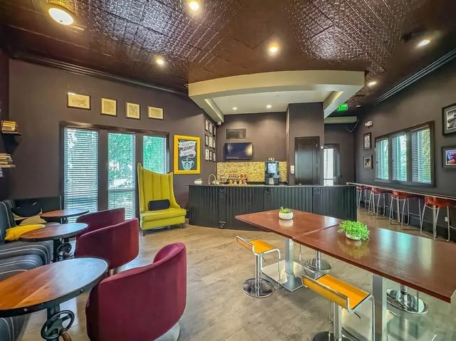 Coffee bar with seating and tables communal area at NXNW in Tallahassee Student Accommodation