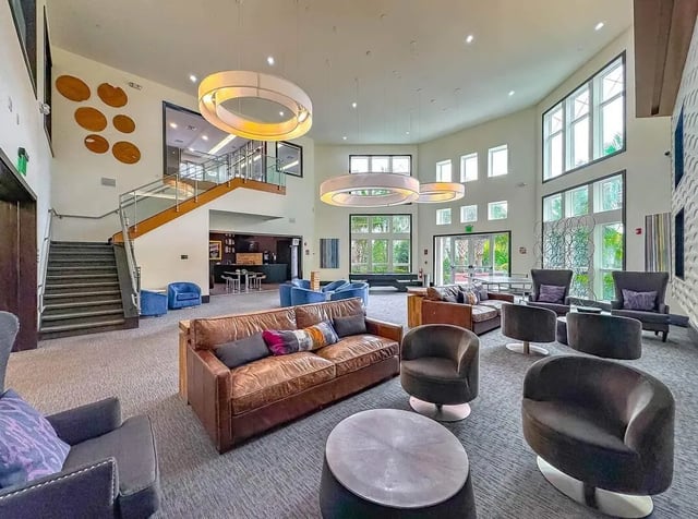 Leather sofas chairs tables a lounge area at NXNW in Tallahassee Student Accommodation