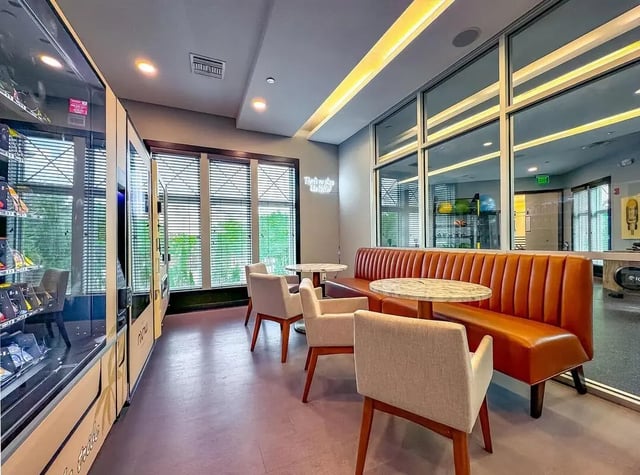 Vending machines sofas chairs tables lounge area at NXNW in Tallahassee Student Accommodation