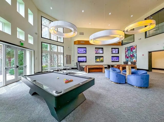 Pool table ping pong tables lounge seating entertainment area common area at NXNW in Tallahassee Student Accommodation