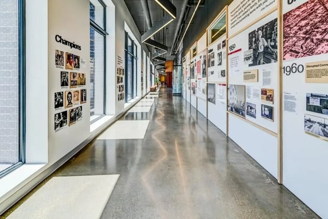 Exhibition hall with photos and text displays. at Chapter at Madison in Madison Student Accommodation