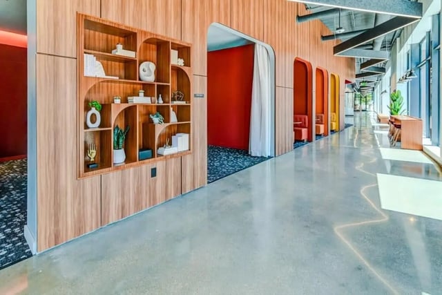 Wooden bookshelf with decor and seating nooks common area at Chapter at Madison in Madison Student Accommodation