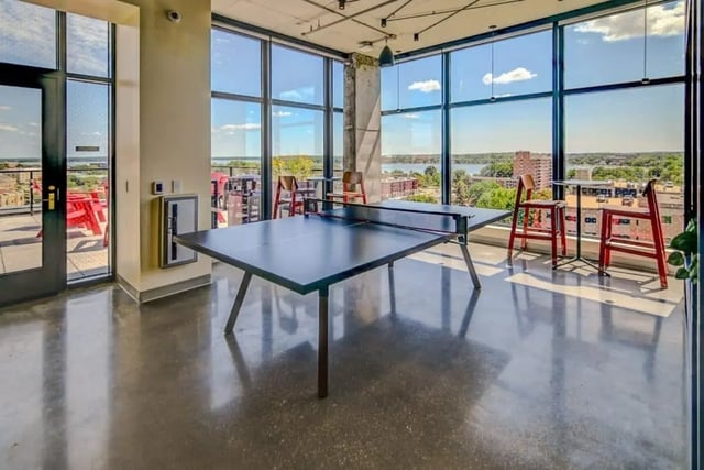 Ping pong table and stools with view amenity area at Chapter at Madison in Madison Student Accommodation