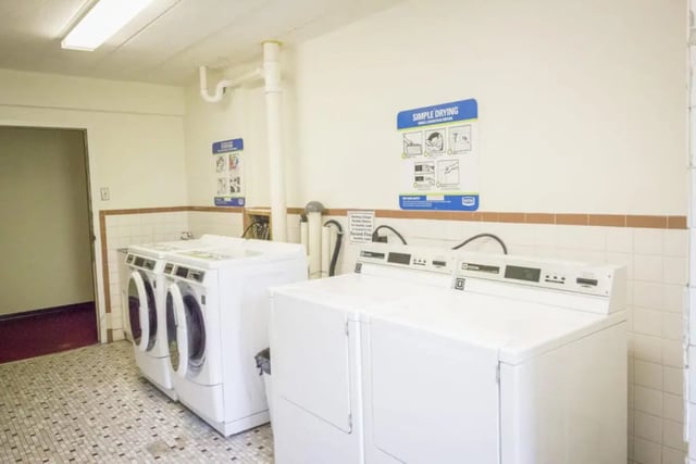 Washing machines and dryers in laundry room at Parkway Plaza in State College Student Accommodation