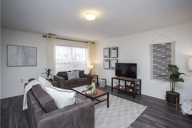Two sofas coffee table TV living room at Parkway Plaza in State College Student Accommodation
