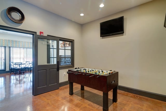 Foosball table television and dining area playing area at Revelry Flats at Milledgeville in Milledgeville Student Accommodation