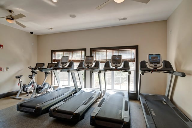 Treadmills and stationary bikes gym area at Revelry Flats at Milledgeville in Milledgeville Student Accommodation
