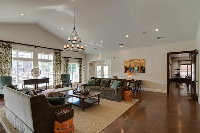 Chandelier Sofas Coffee Table Living Room at Revelry Flats at Milledgeville in Milledgeville Student Accommodation
