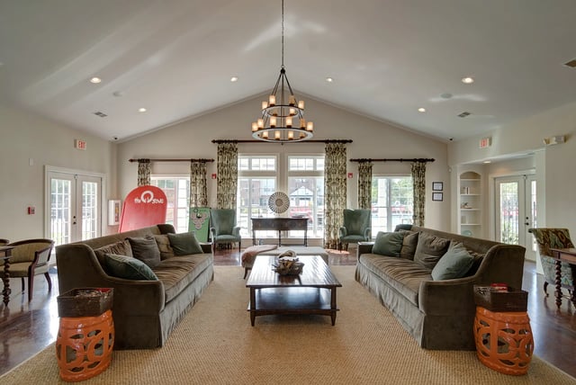 Sofas coffee table two chairs living room at Revelry Flats at Milledgeville in Milledgeville Student Accommodation