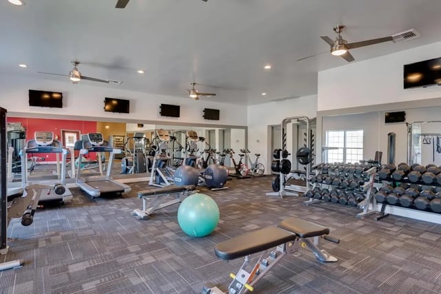 Treadmills ellipticals weight racks exercise equipment fitness center at Grove at Cheney in Pullman Student Accommodation
