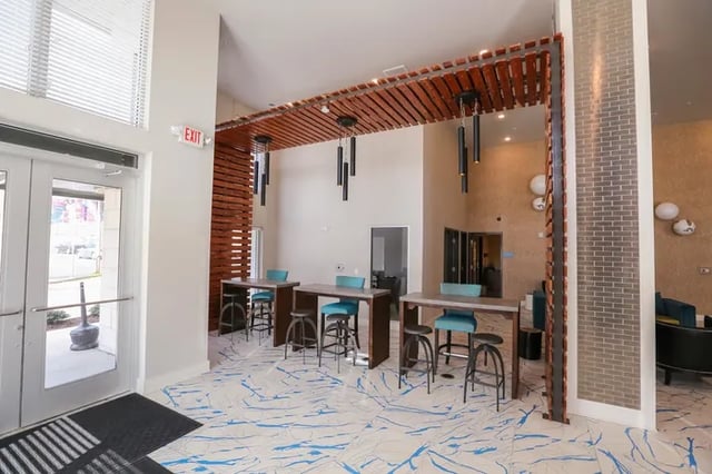 High tables with blue stools common area at Douglas Heights in Chattanooga Student Accommodation
