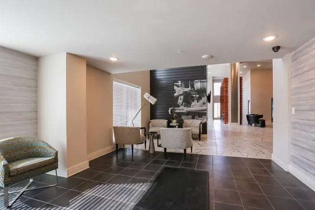 Modern lobby with chairs and artwork Living room at Douglas Heights in Chattanooga Student Accommodation