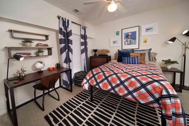 Bed desk shelves pillows curtains rug Bedroom at Quarry Trail in Knoxville Student Accommodation
