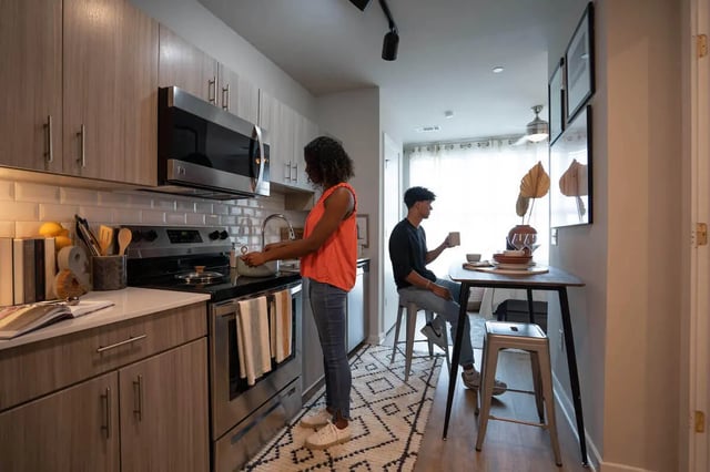 Modern kitchen with counter seating kitchen area at Summit Place in Charleston Student Accommodation