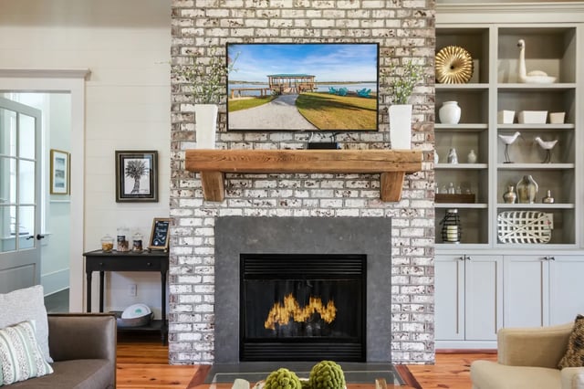 Fireplace with TV and bookshelves Living room at Sweetwater in Charleston Student Accommodation