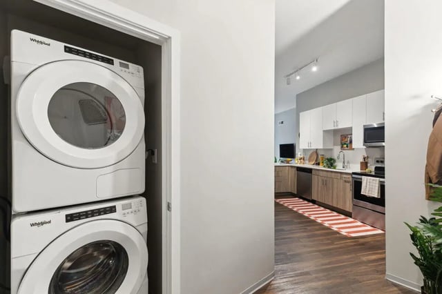 Stacked washer dryer and kitchen area at Paloma at University City in Philadelphia Student Accommodation
